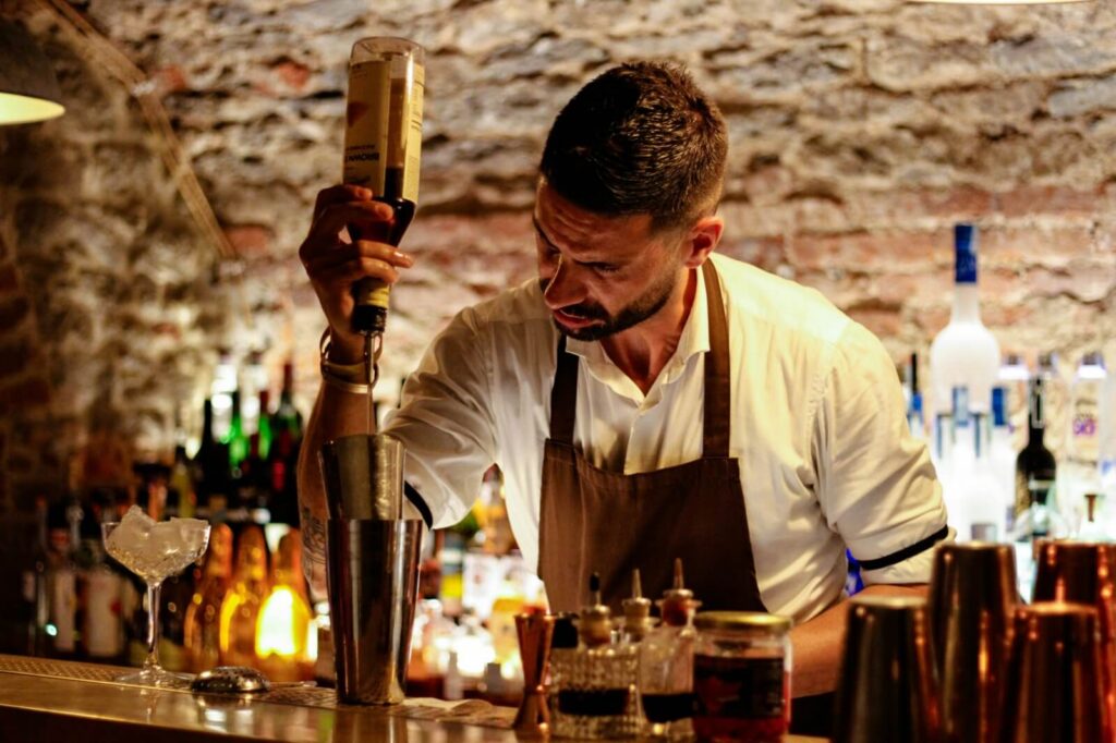 Bartender preparing signature cocktail
