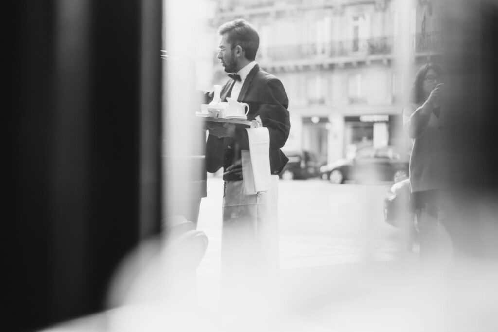 Restaurant staff assisting guests